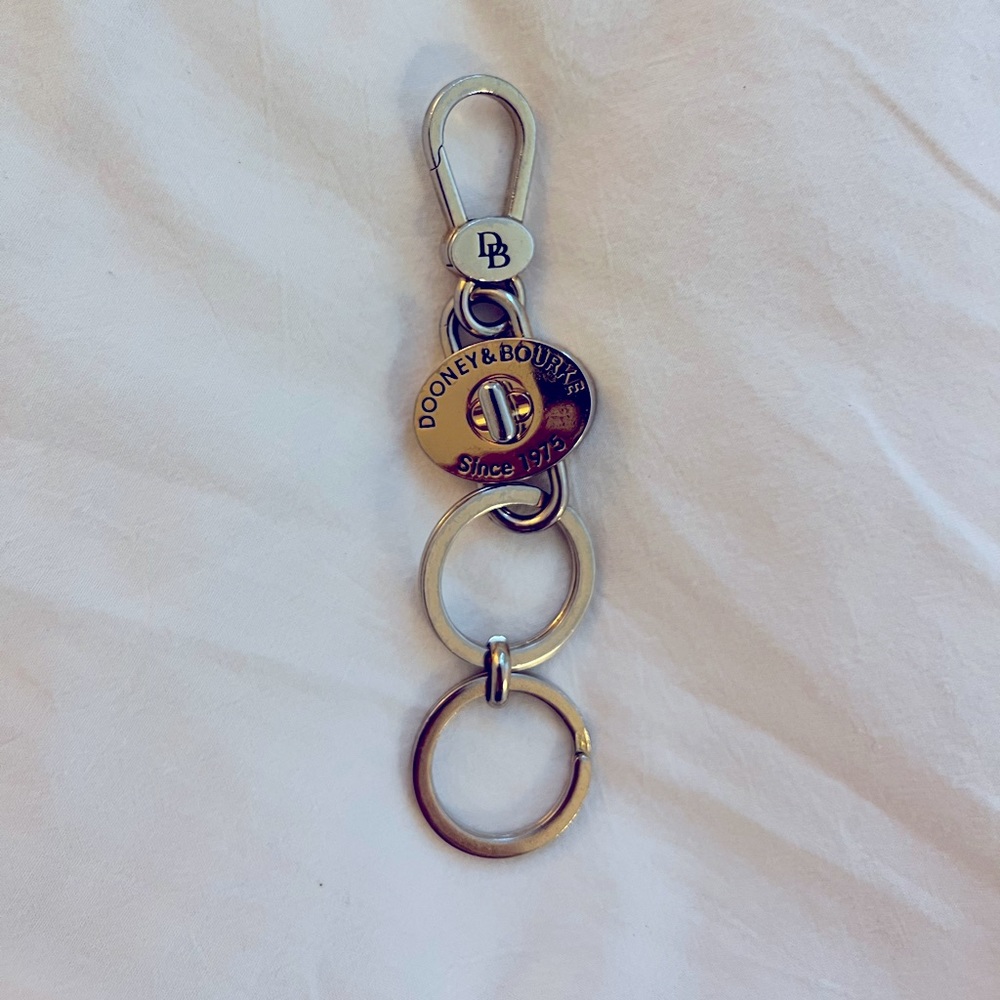 Up for sale is a used genuine Dooney & Bourke valet key ring/fob.